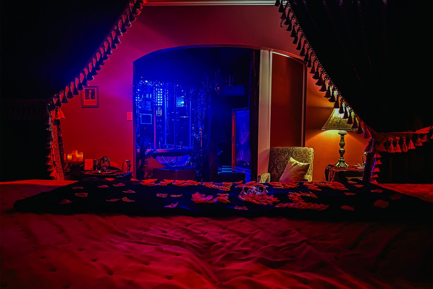 View from the large bed, looking out at the jacuzzi and beautifully decorated suite.