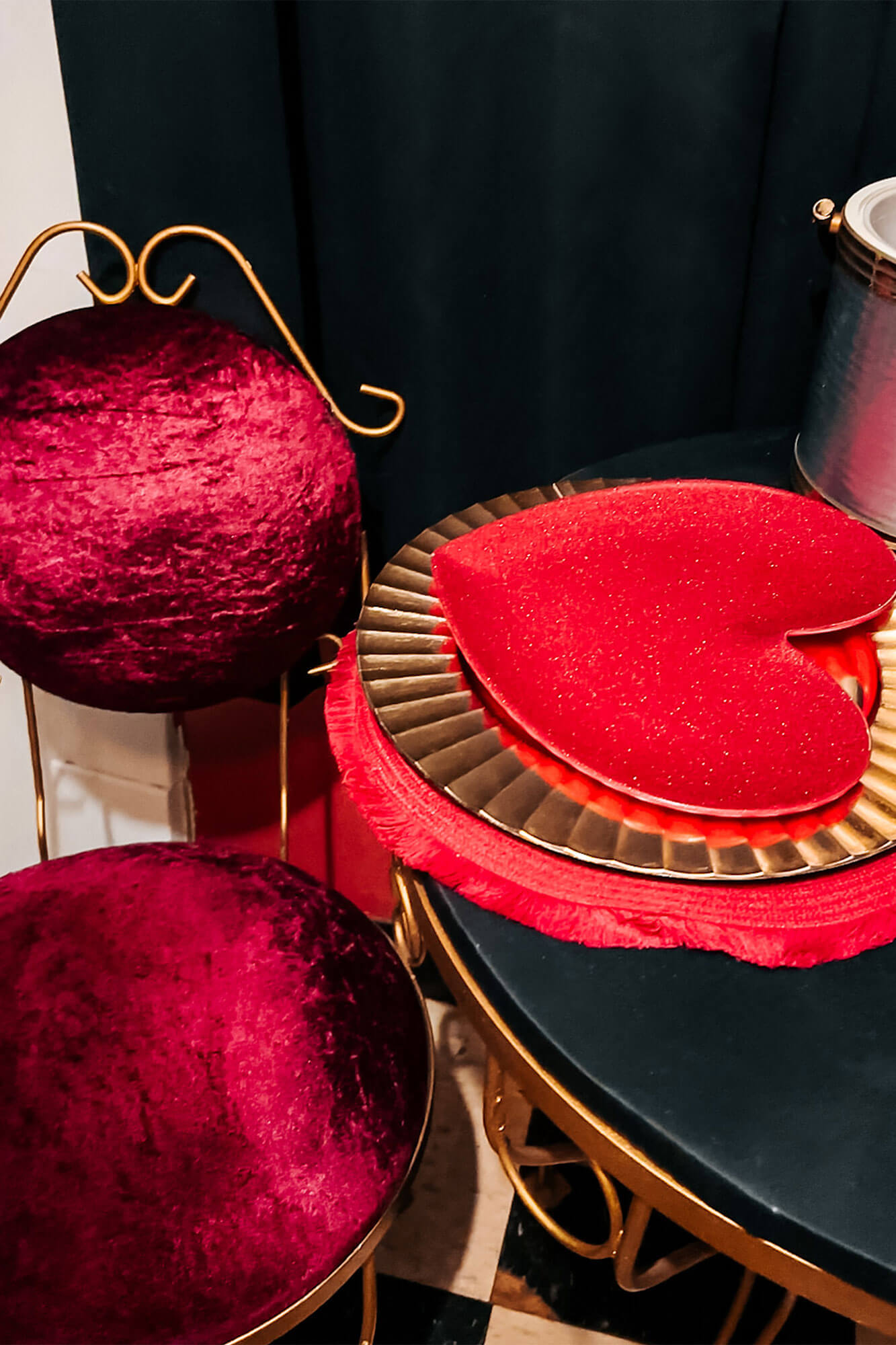 A red velvet chair with a romantic place setting, adding charm to the retreat.